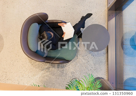 Top view of woman reading book 131350960