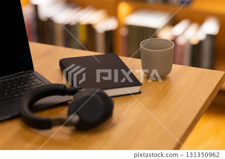 Cozy workspace with books and coffee 131350962