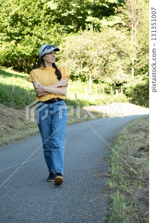 European woman walking in nature, looking away European woman walking in nature, looking away 131351007
