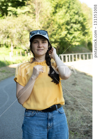 Natural Portrait of a 30-Year-Old Woman Without Makeup Outdoors in Nature Natural Portrait of a 30-Year-Old Woman Without Makeup Outdoors in Nature 131351008