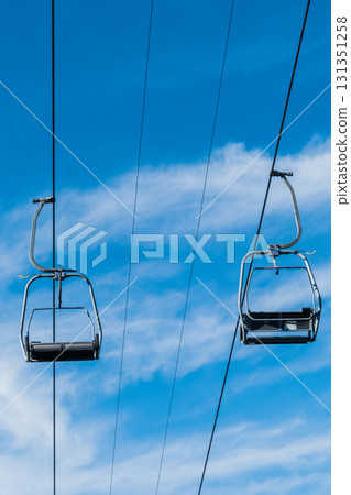 Chair Lift above the mountains and green forest of Bulgaria. Eco tourism. Tourist attraction. Seven Rila lakes. Cable car in Rila Mountains Chair Lift above the mountains and green forest of Bulgaria. Eco tourism. Tourist attraction. Seven Rila lakes. Cable car in Rila Mountains 131351258