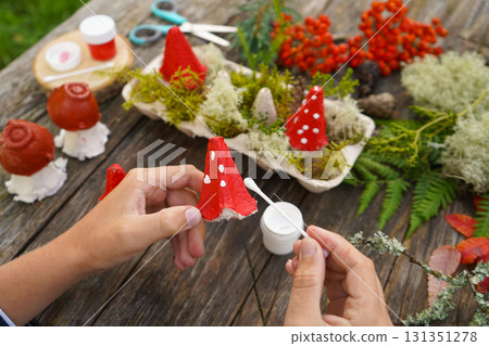 Zero waste fall project using natural and recycled materials to create a mushroom figure. 131351278