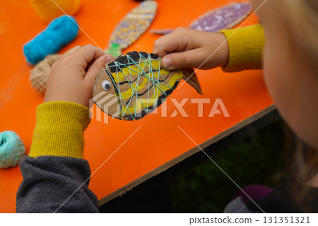 Build a fish model from cardboard, thread, and paint, with step-by-step instructions, on an orange background. Build a fish model from cardboard, thread, and paint, with step-by-step instructions, on an orange background. 131351321