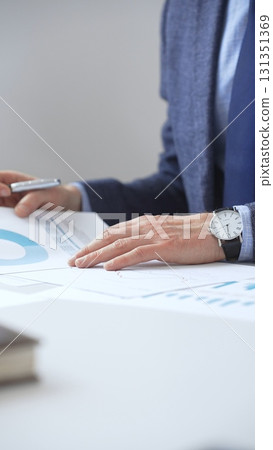 Professional analyzing financial charts on laptop, reviewing data for strategic business planning and investment optimization. Business people concept 131351369