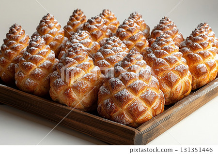 Baking blogs. Christmas buns in the shape of a pine cone in on a wooden trading tray on a white background. Baking blogs. Christmas buns in the shape of a pine cone in on a wooden trading tray on a white background. 131351446