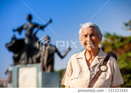 Senior woman traveling at the Ronda del Sinu linear park of Monteria in the department of Cordoba, Colombia. 131351483