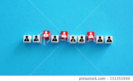 Employee figures with some highlighted in red. Staff selection. 131351930
