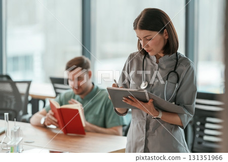 Two doctors are working indoors Two doctors are working indoors 131351966