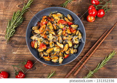 Plate of mussels on a table. Plate of mussels on a table. 131352336
