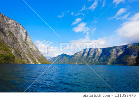 View from a sightseeing boat in the Norwegian fjords View from a sightseeing boat in the Norwegian fjords 131352470