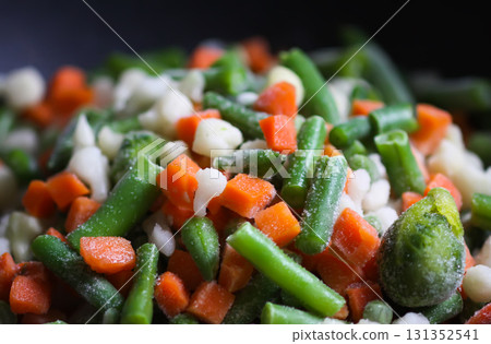 Frozen mix of cauliflower, carrots, and green beans on pan. 131352541