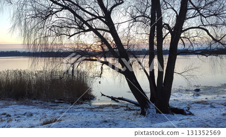 Picturesque snowy scene with river in cold season. 131352569