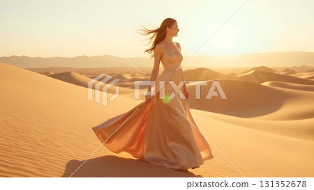 Woman in elegant dress dances gracefully on sandy dunes during golden hour in a desert landscape 131352678