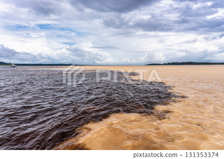 Meeting of the waters of the Negro and Solimoes rivers in the city of Manaus in Amazonia, Brazil Meeting of the waters of the Negro and Solimoes rivers in the city of Manaus in Amazonia, Brazil 131353374