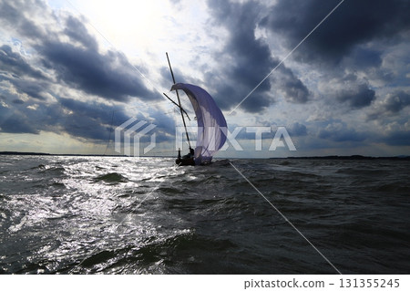 A traditional sight in Kasumigaura City: sailing boats A traditional sight in Kasumigaura City: sailing boats 131355245