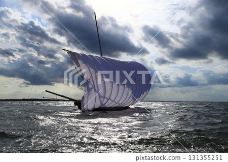 A traditional sight in Kasumigaura City: sailing boats A traditional sight in Kasumigaura City: sailing boats 131355251