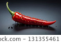 Vibrant red chili pepper rests on a slick, dark background, showcasing fresh cooking ingredient. Glossy texture and dramatic lighting evoke freshness, spice, and bold culinary appeal Vibrant red chili pepper rests on a slick, dark background, showcasing fresh cooking ingredient. Glossy texture and dramatic lighting evoke freshness, spice, and bold culinary appeal 131355461
