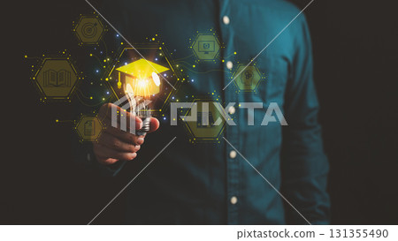 Person holding glowing light bulb with graduation cap icon and education symbols, representing innovative learning, knowledge development, beyond schooling and creative ideas in modern education. 131355490