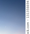 Crescent moon floating in the blue sky 131356694