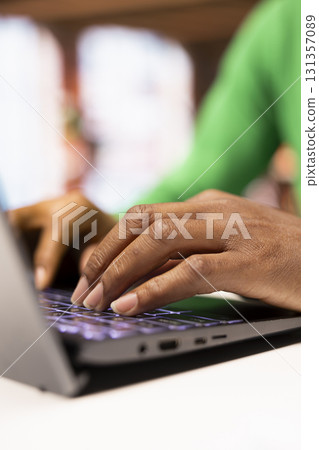 Teleworker in home office typing on laptop keyboard, preparing presentation slides, adjusting layouts. Close up of freelancer finishing company project, writing summaries, saving files on notebook 131357089