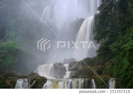 waterfall in green forest 131357318