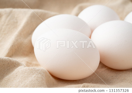 Close-up of chicken eggs placed on a cloth 131357326