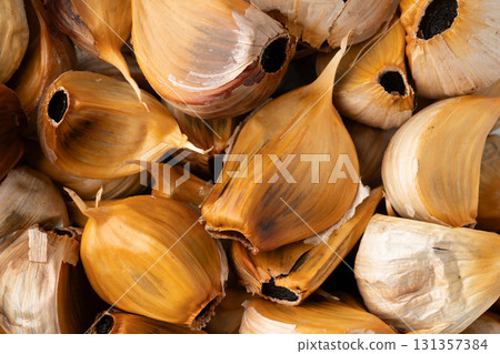 Close-up of black garlic (with skin) 131357384