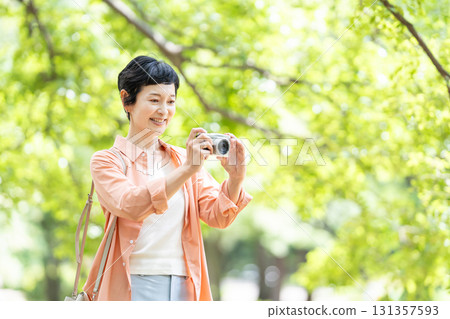 Senior woman travel camera Senior woman travel camera 131357593