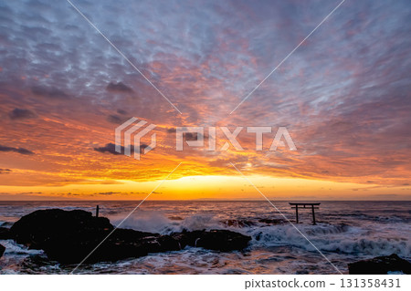 Dawn at the Kamiiso Torii Gate dyed in the morning glow [Oarai Coast, Ibaraki Prefecture] 131358431