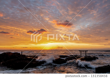 Dawn at the Kamiiso Torii Gate dyed in the morning glow [Oarai Coast, Ibaraki Prefecture] 131358438