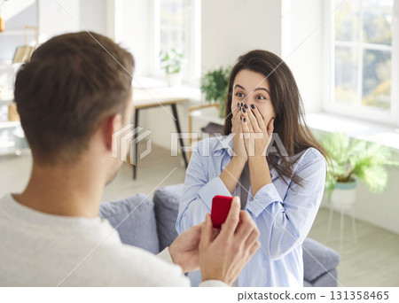 Marry me proposing, man holding red box with marriage engagement ring, proposal  131358465