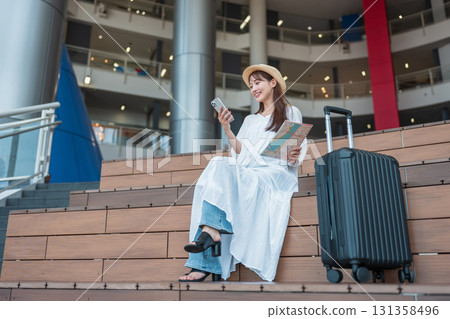 A woman planning a trip A woman planning a trip 131358496