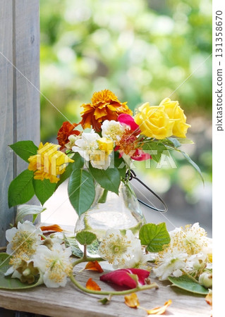 Roses and kiwi flowers 131358670