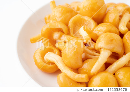 Close-up of large nameko mushrooms on a plate 131358676