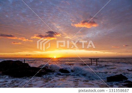 Dawn at the Kamiiso Torii Gate dyed in the morning glow [Oarai Coast, Ibaraki Prefecture] 131358687