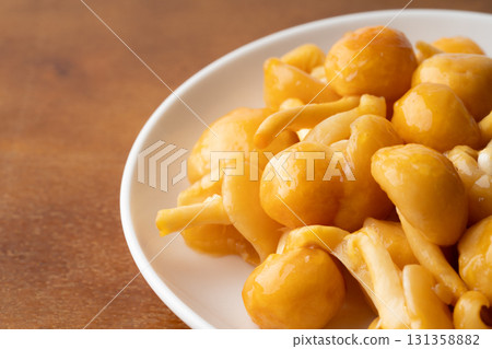 Close-up of large nameko mushrooms on a plate 131358882