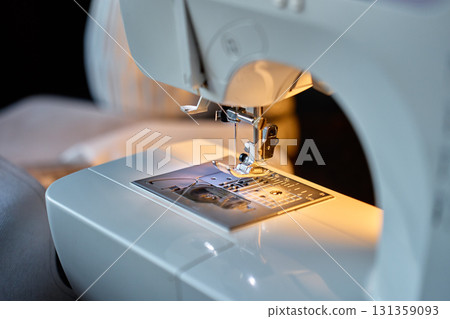 Close-up of sewing machine needle and presser foot Close-up of sewing machine needle and presser foot 131359093