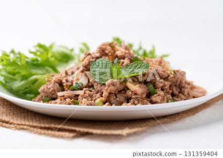Local Thai food, Spicy minced pork salad (Larb Moo) on white background Local Thai food, Spicy minced pork salad (Larb Moo) on white background 131359404