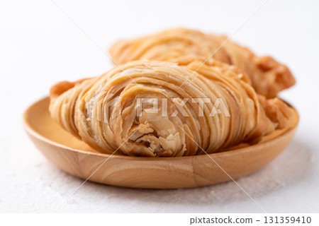 Curry puff stuffed with chicken or sweet potatoes, Thai snack food style 131359410