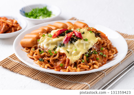 Korean spicy instant noodles with kimchi, sausage and Mozzarella cheese Korean spicy instant noodles with kimchi, sausage and Mozzarella cheese 131359423