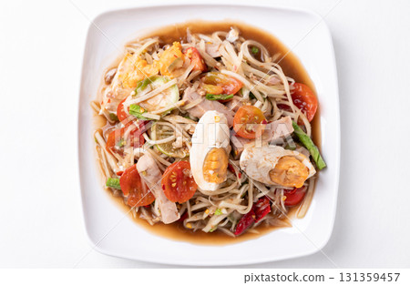 Thai food (Som Tum), Spicy papaya salad with steamed pork sausage and salted egg Thai food (Som Tum), Spicy papaya salad with steamed pork sausage and salted egg 131359457