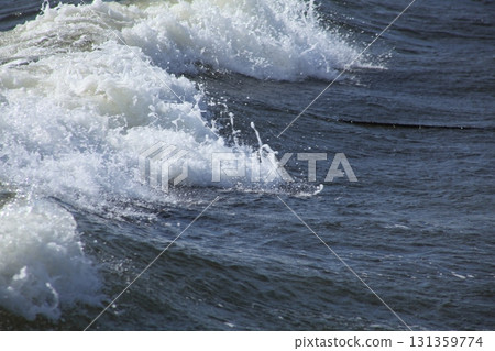 Rough waves crashing on the shore 131359774