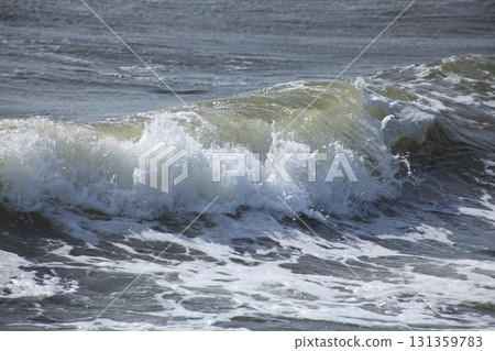 Rough waves crashing on the shore 131359783