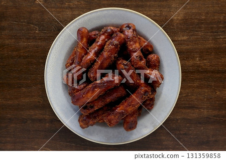 Brown sugar karinto (black karinto) served on a plate on a table background viewed from directly above 131359858