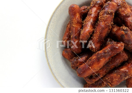 Brown sugar karinto (black karinto) served on a plate on a white background viewed from directly above 131360322