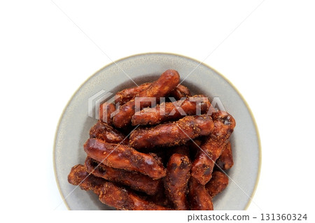 Brown sugar karinto (black karinto) served on a plate on a white background viewed from directly above Brown sugar karinto (black karinto) served on a plate on a white background viewed from directly above 131360324