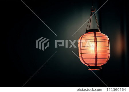 Glowing paper lantern against dark background 131360564