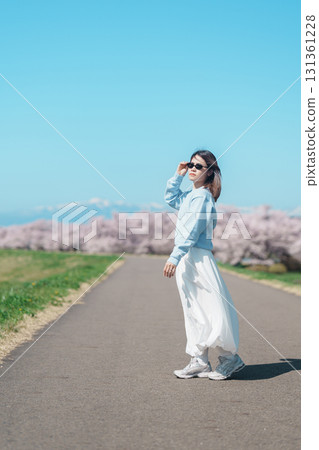 Woman tourist sightseeing Kitakami Tenshochi Park with Sakura Cherry Blossom in Spring, traveler travel in Kitakami festival, Iwate prefecture, Japan. Landmark for Travel and Vacation destination Woman tourist sightseeing Kitakami Tenshochi Park with Sakura Cherry Blossom in Spring, traveler travel in Kitakami festival, Iwate prefecture, Japan. Landmark for Travel and Vacation destination 131361228