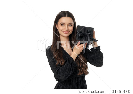 Young woman with a gift box for Black Friday, isolated, PNG Young woman with a gift box for Black Friday, isolated, PNG 131361428