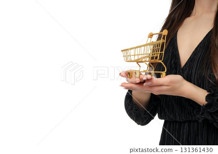 Woman shows mini cart for Black Friday deals, isolated, PNG Woman shows mini cart for Black Friday deals, isolated, PNG 131361430